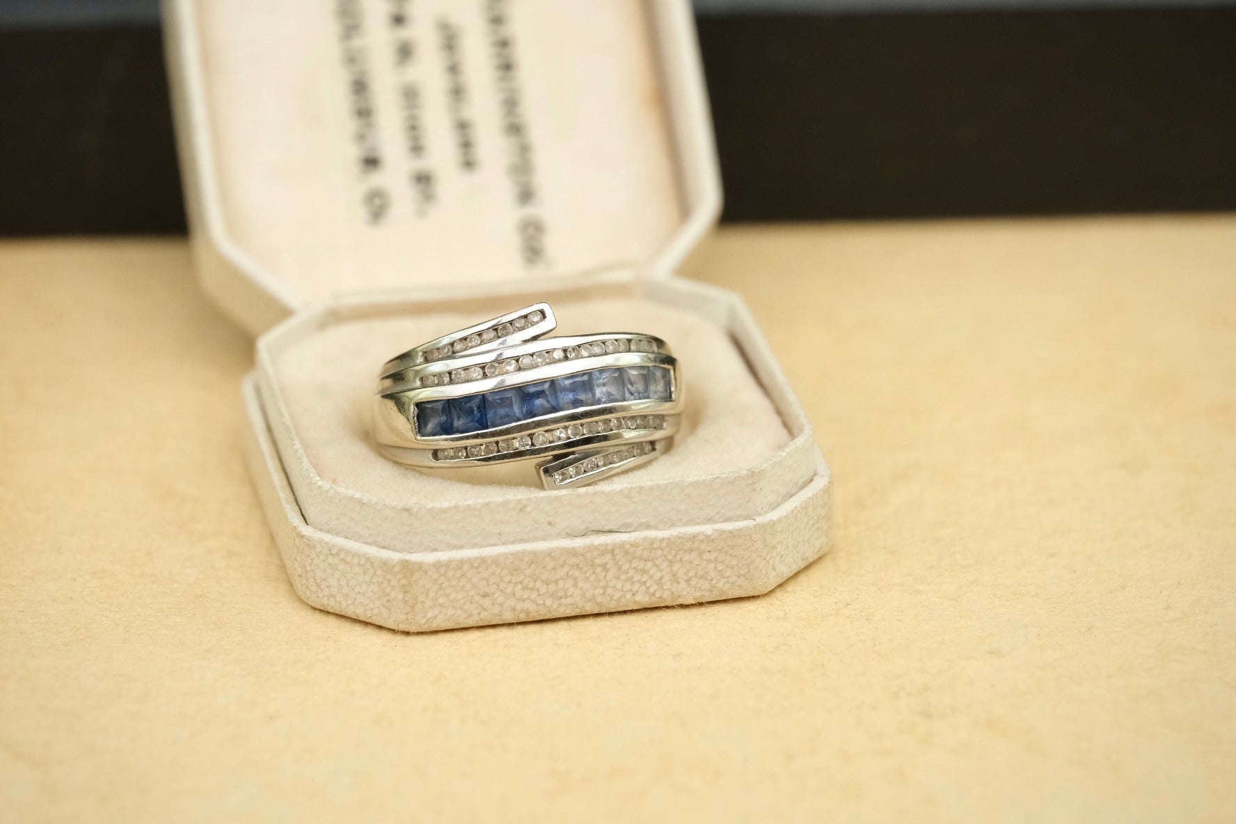 14K gold graduated blue sapphire and diamond bypass ring