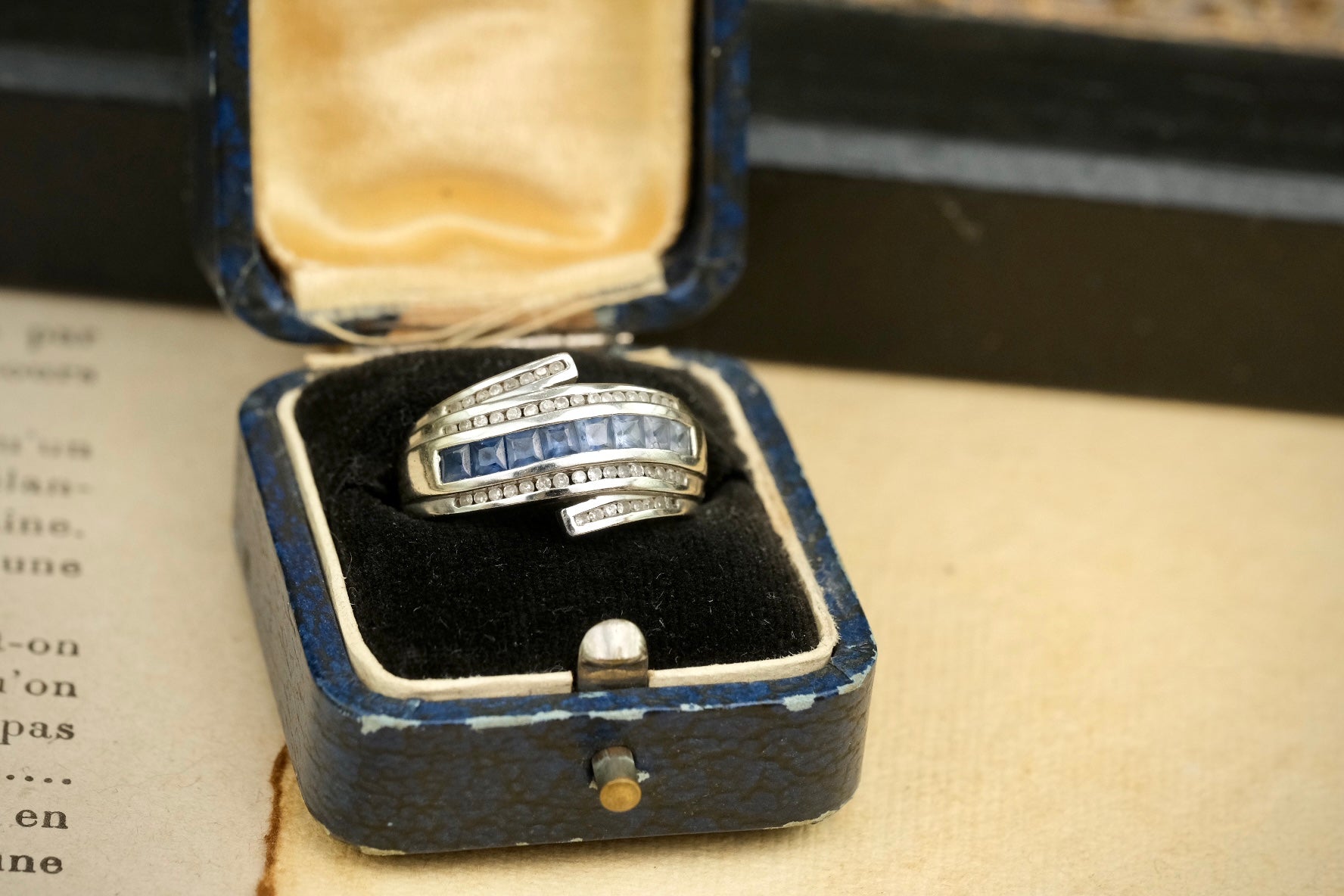 14K gold graduated blue sapphire and diamond bypass ring