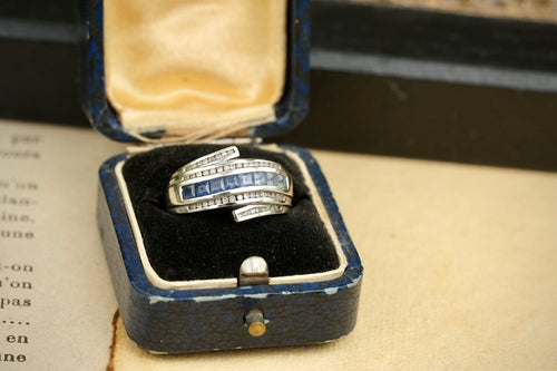 14K gold graduated blue sapphire and diamond bypass ring