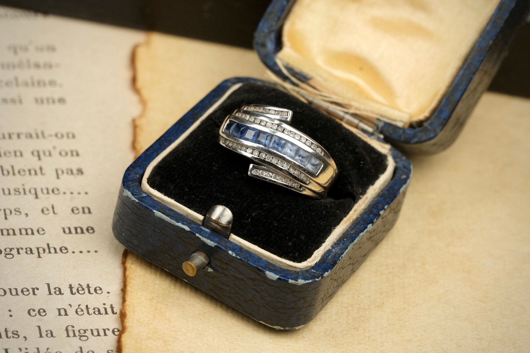 14K gold graduated blue sapphire and diamond bypass ring