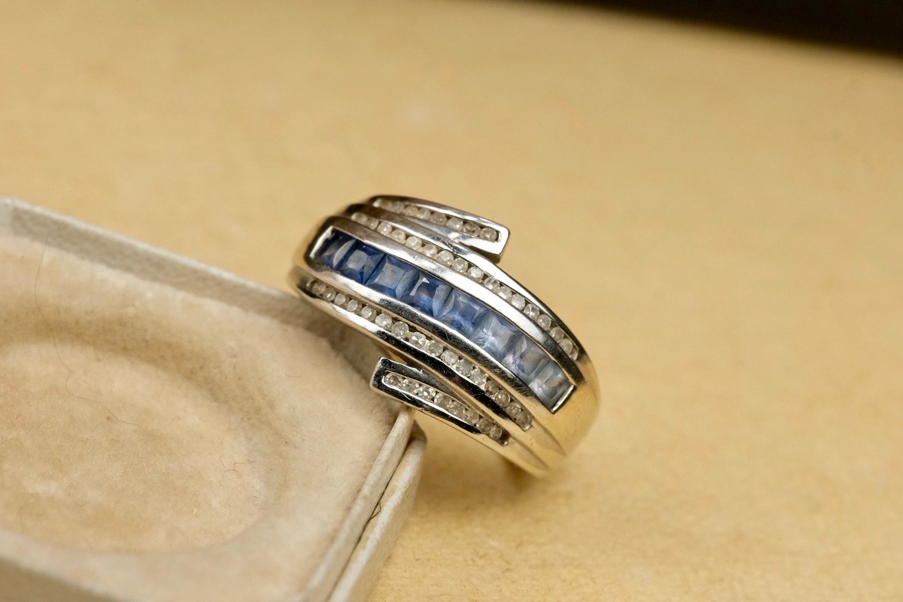 14K gold graduated blue sapphire and diamond bypass ring