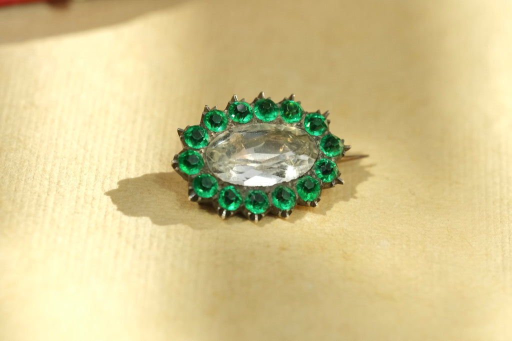 Georgian early 19th-century brooch close-up showing green paste and central clear stone