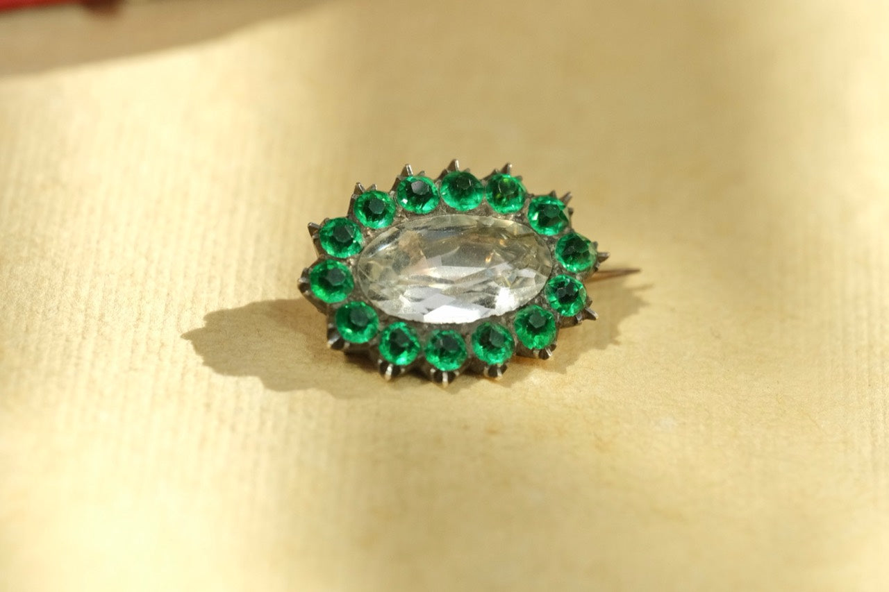 Georgian early 19th-century brooch close-up showing green paste and central clear stone