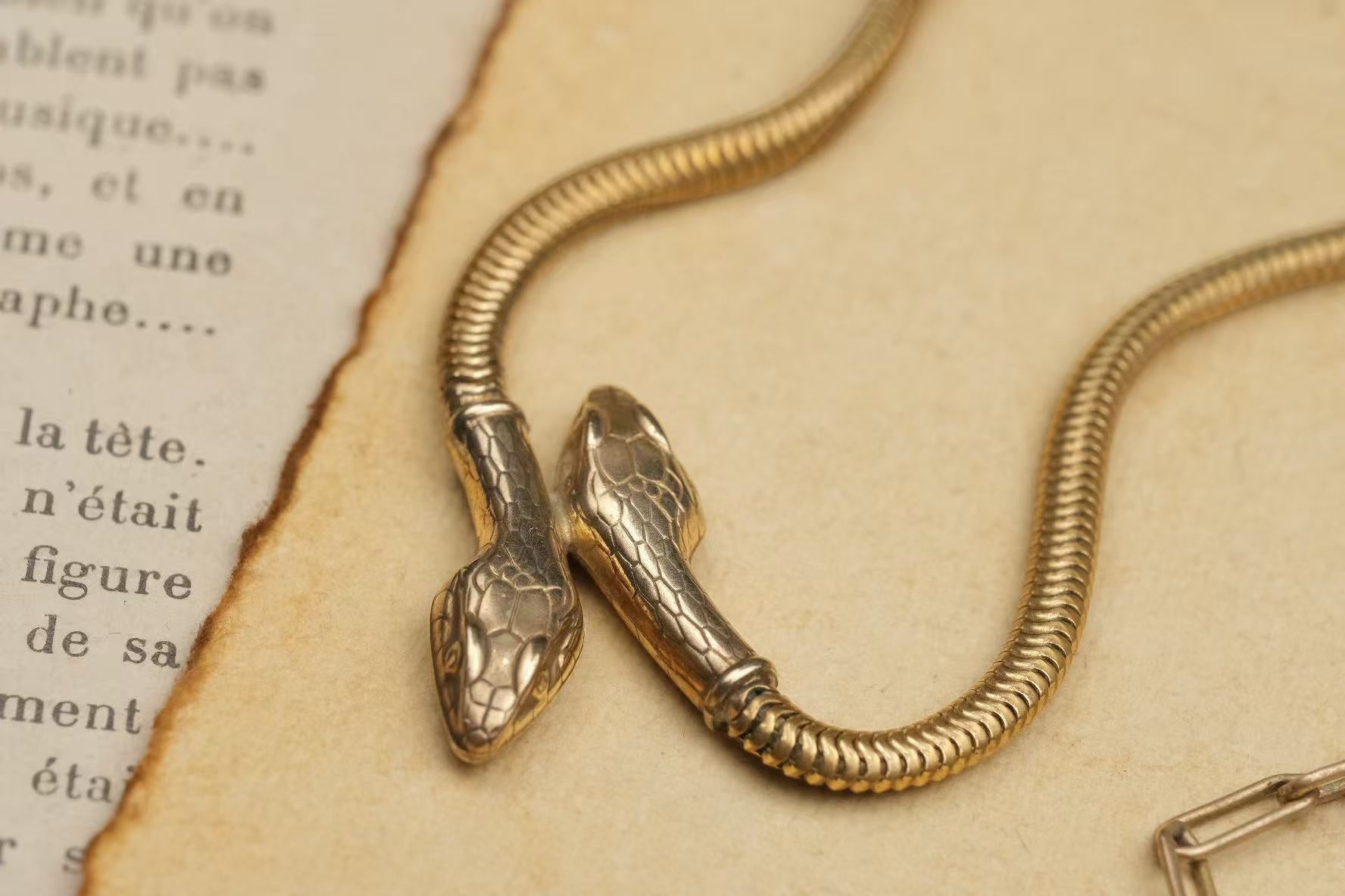 circa 1930s gold-plated double-headed snake necklace head and chain detail