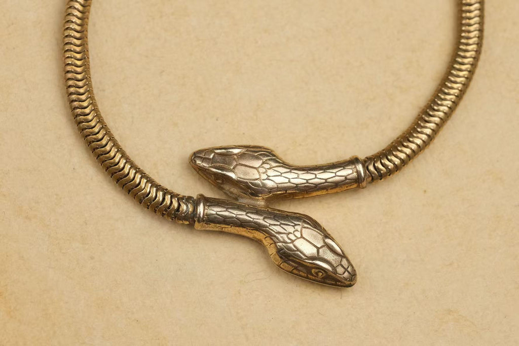 circa 1930s gold-plated double-headed snake necklace intertwined heads