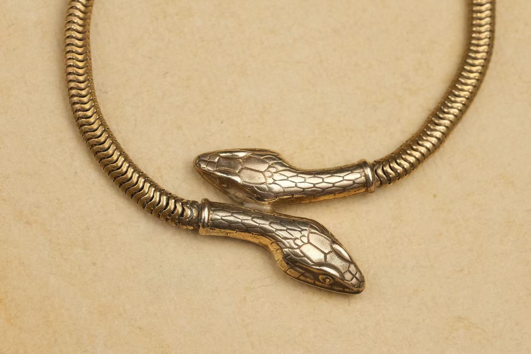 circa 1930s gold-plated double-headed snake necklace intertwined heads