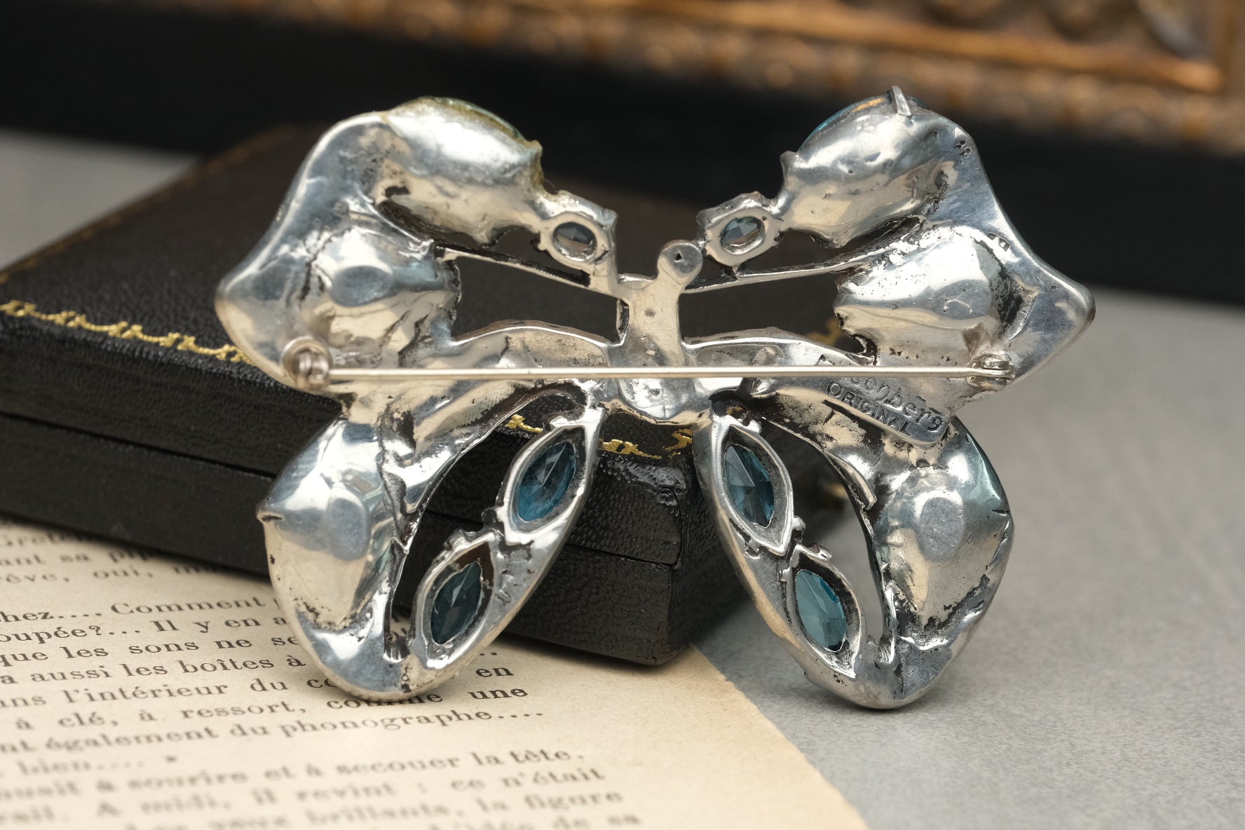 Eisenberg Original signature and pin mechanism on back of blue bow brooch