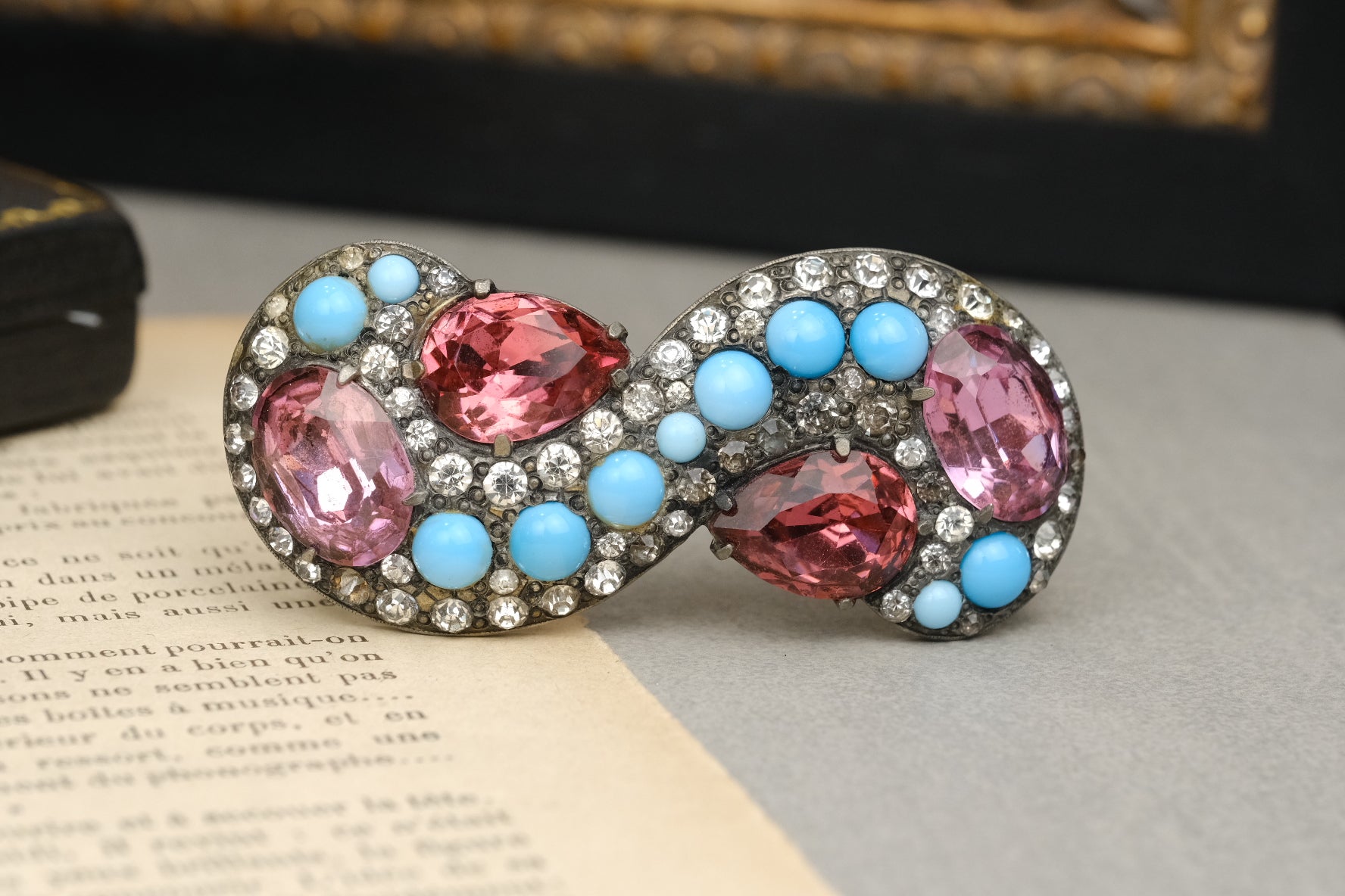 Vintage Eisenberg Original signed pink and blue infinity knot brooch front view