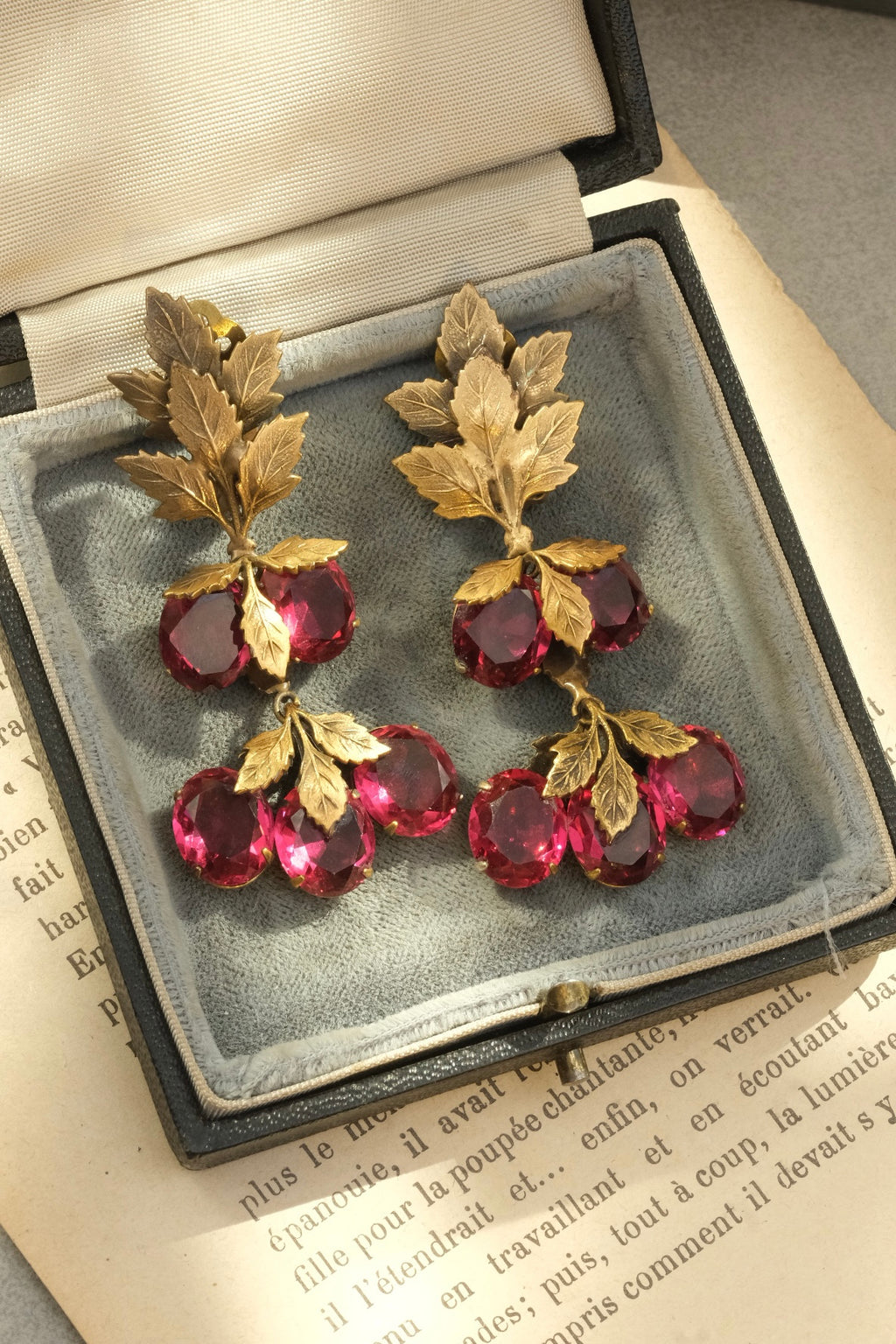 Full pair of ruby glass fruit cluster and sculpted leaf drop earrings