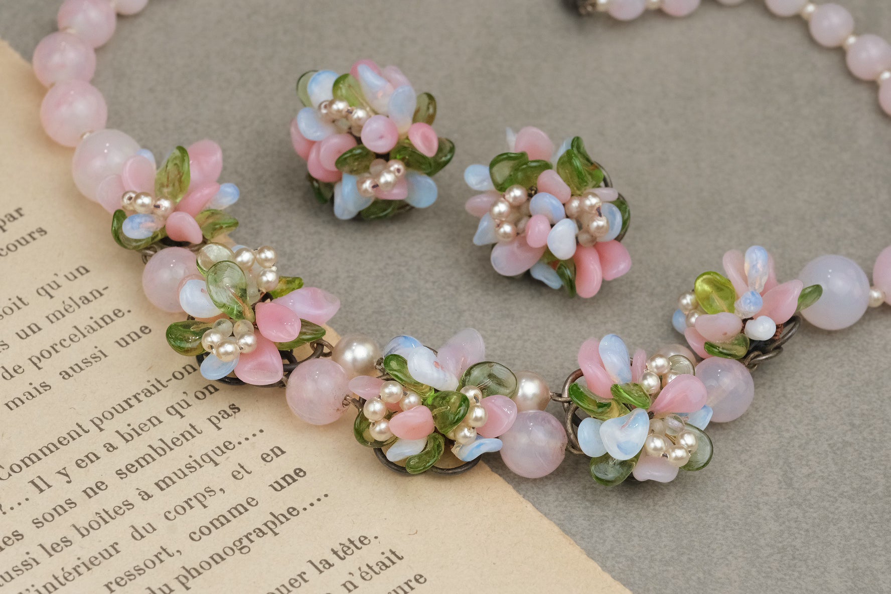 Louis Rousselet pastel pink blue and green glass flower necklace and earrings detail