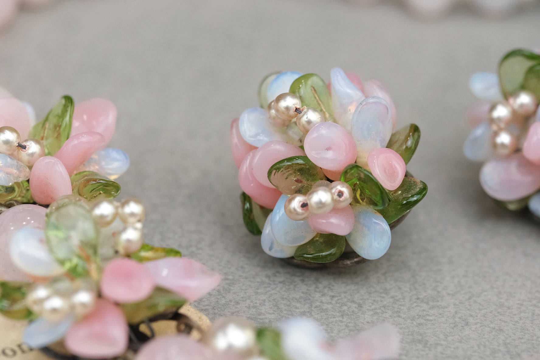 Vintage pastel glass flower clip-on earring close-up