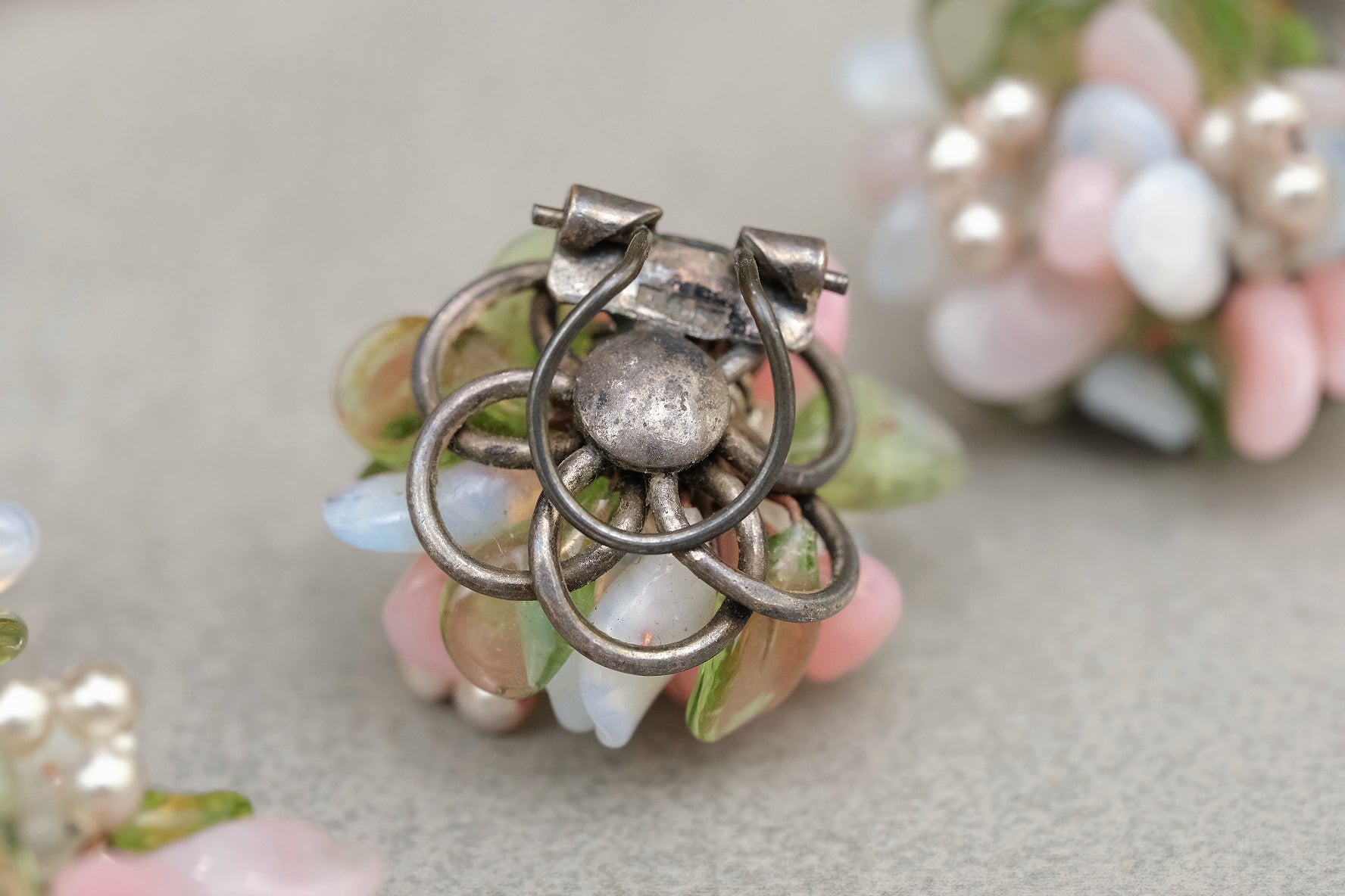 Francel mark and clip-on fitting on reverse of glass flower earring