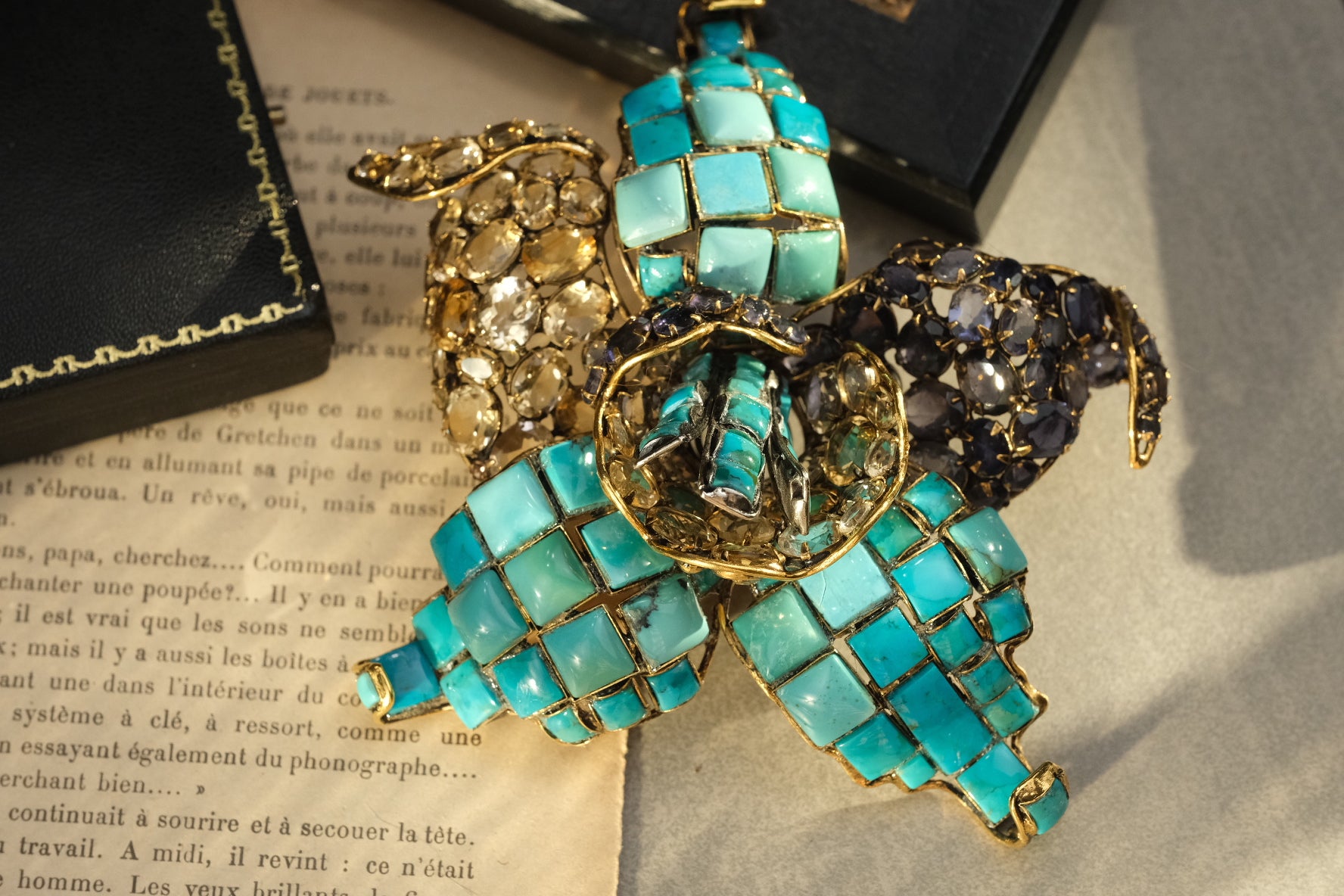 Massive signed Iradj Moini orchid brooch with turquoise, citrine, clear crystal, and blue-violet stones