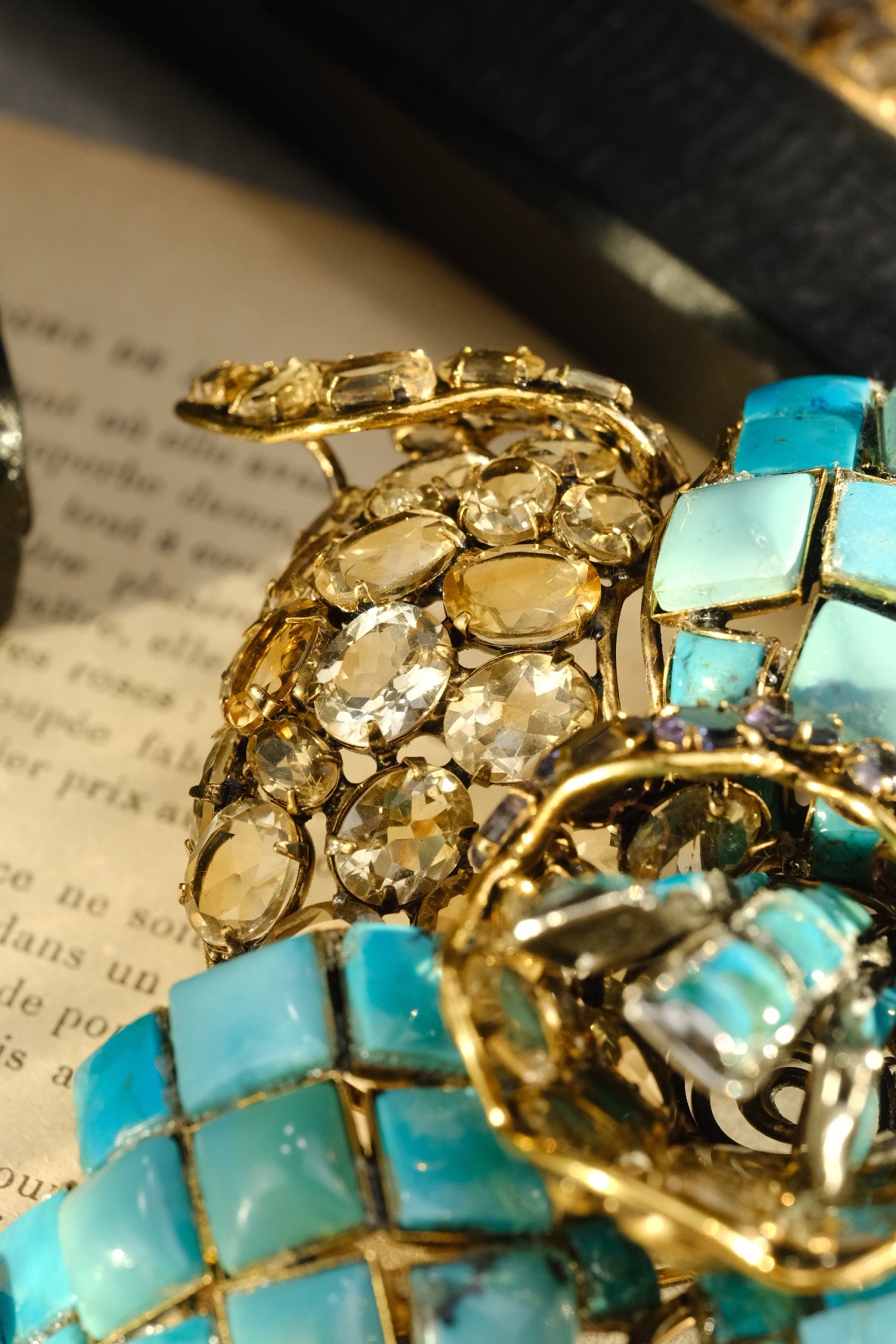 Close-up of natural citrine and clear crystal stones on Iradj Moini orchid brooch