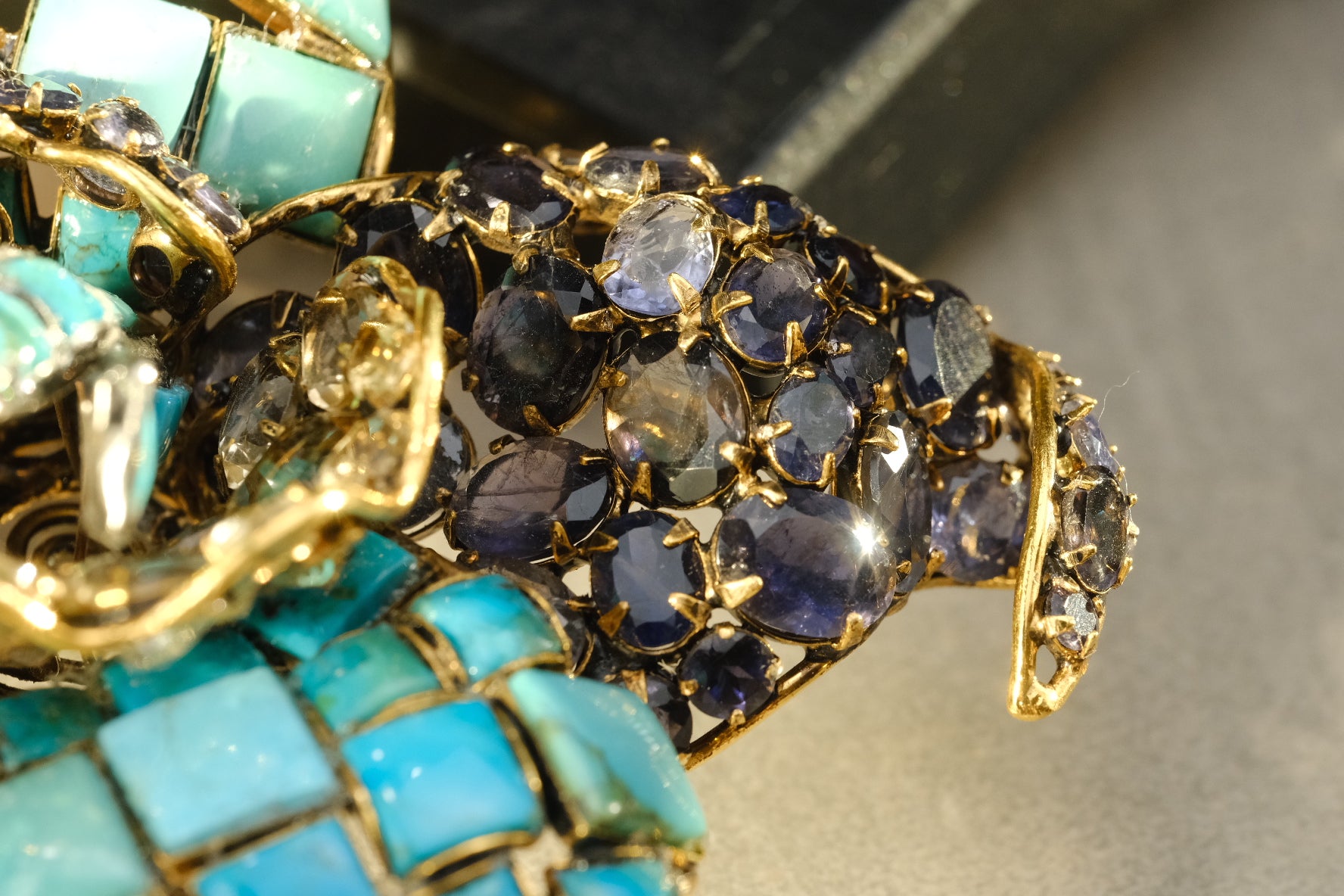Close-up of blue-violet stones, believed to be iolite, on Iradj Moini orchid brooch