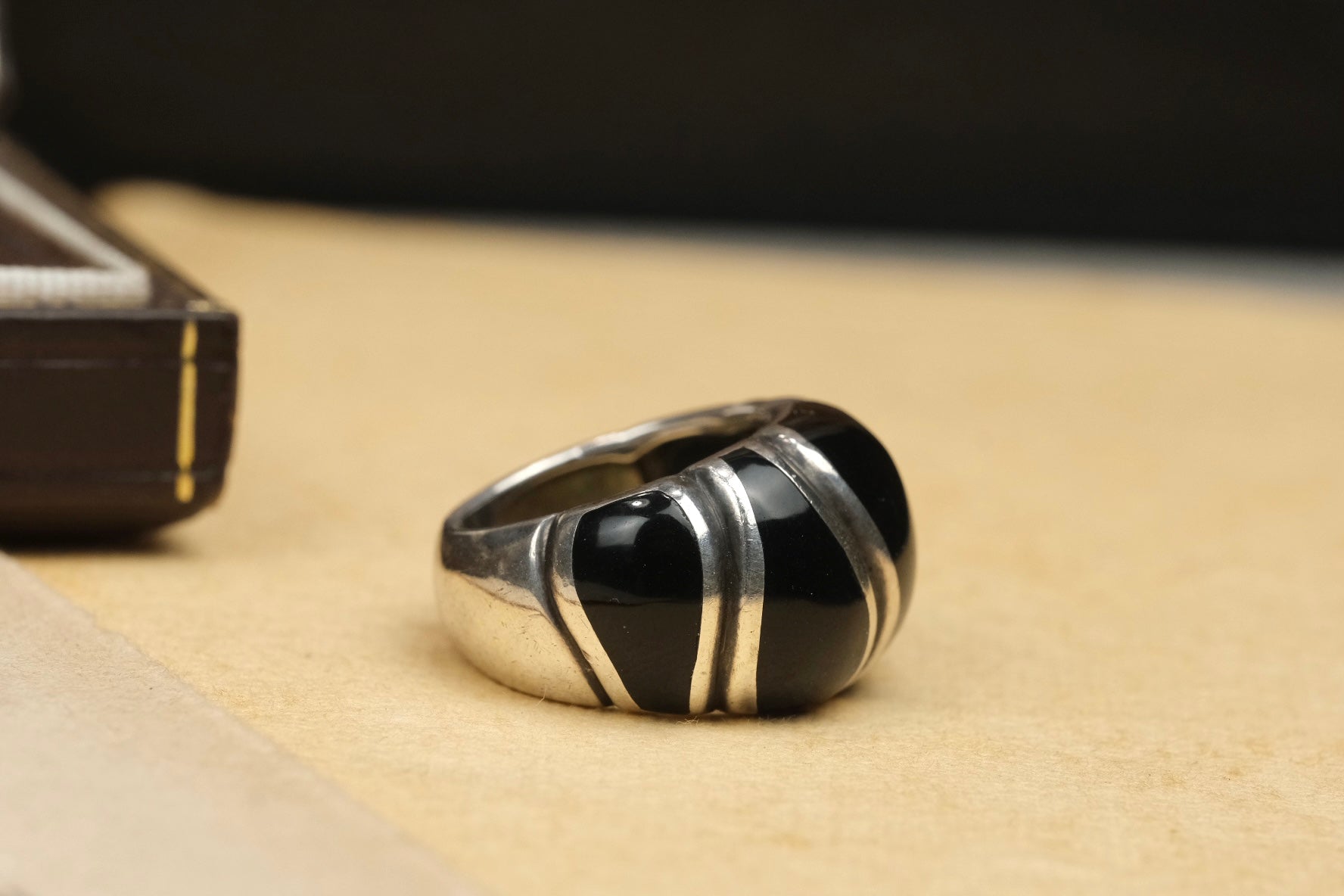 Vintage Mexican sterling silver black onyx ring, angled view