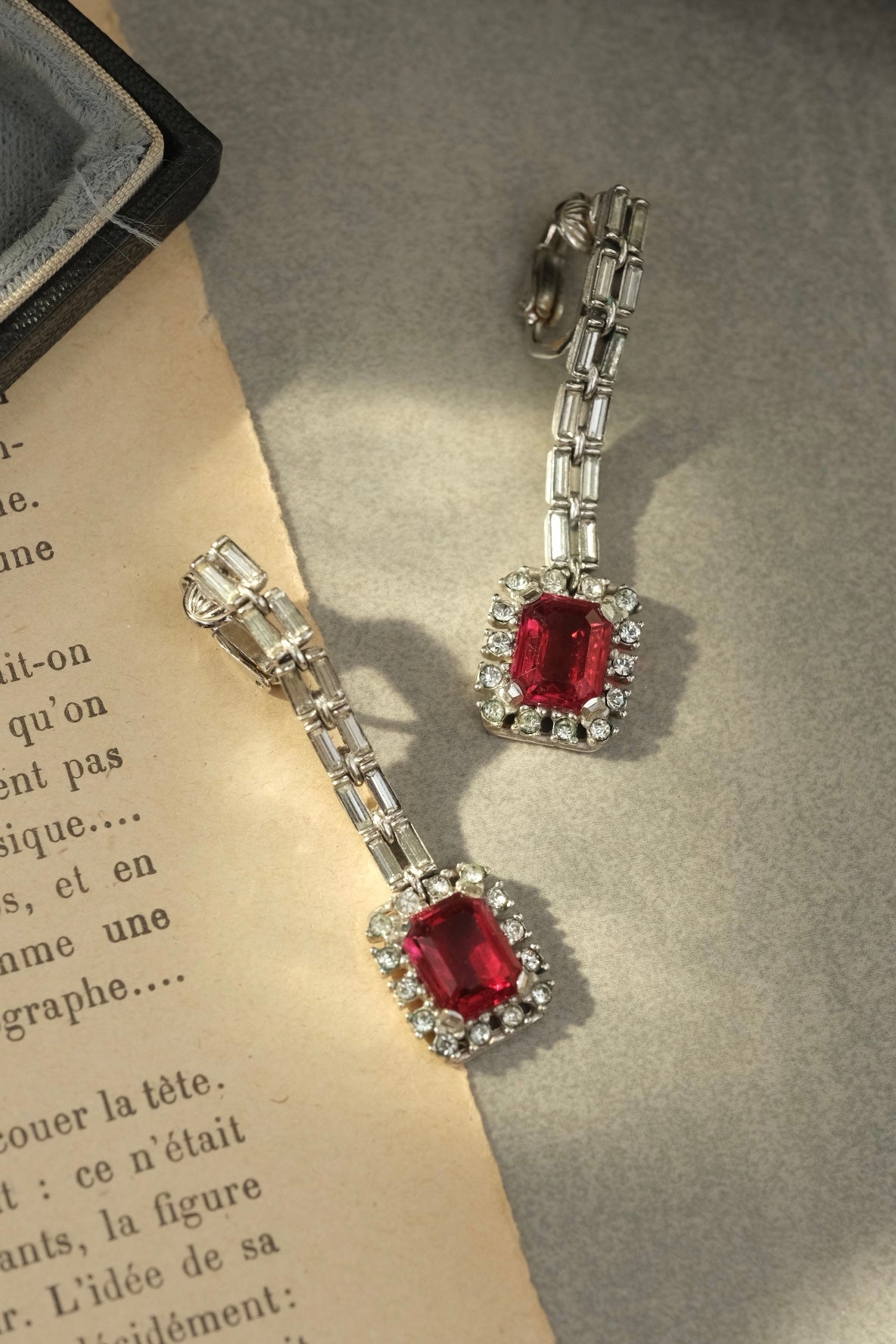 Vintage signed Ciner red glass and rhinestone Art Deco style long clip-on earrings, full view