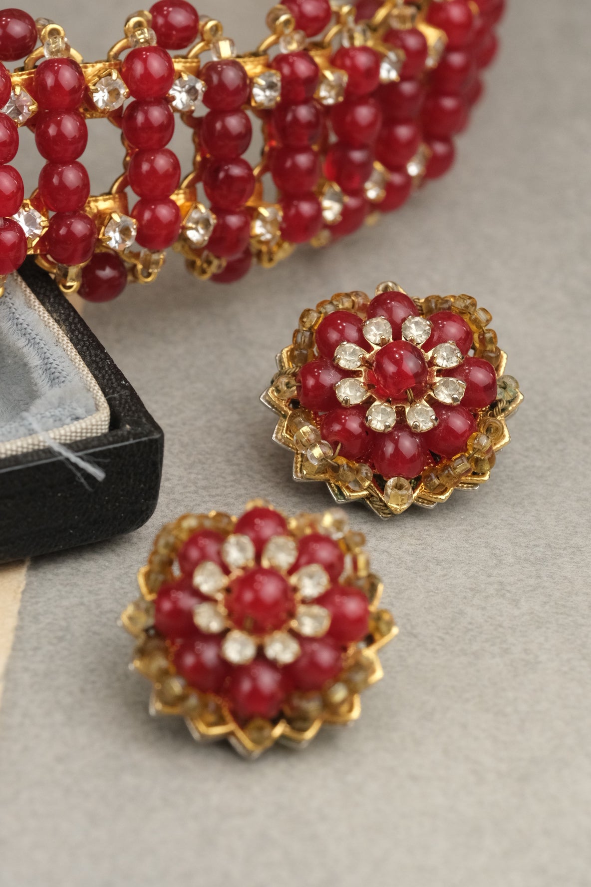 Floral red glass and rhinestone clip-on earrings with coordinating necklace