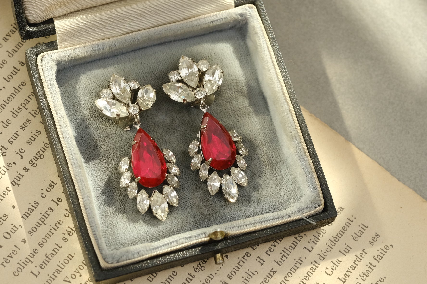 Vintage Western Germany ruby red glass and clear rhinestone drop clip-on earrings, full view