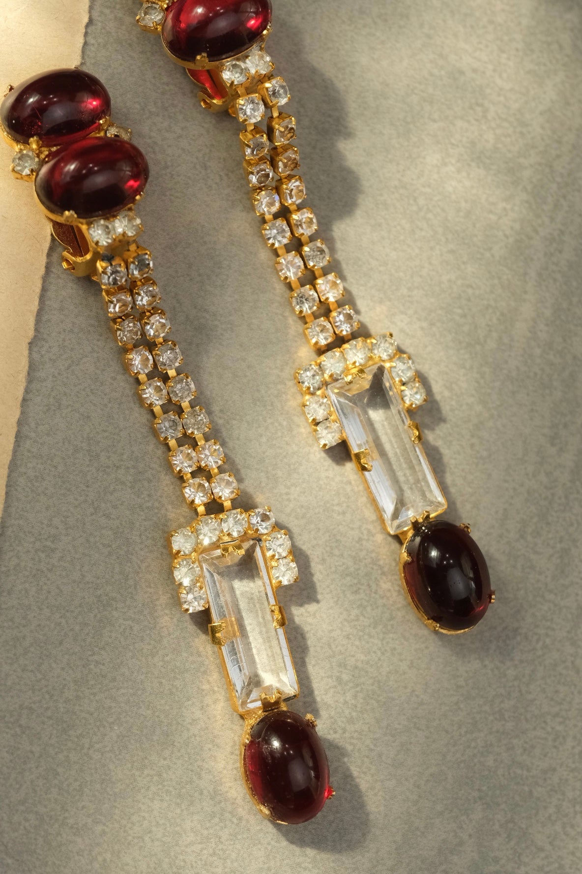 Long rhinestone strands and glass drop details on William DeLillo earrings